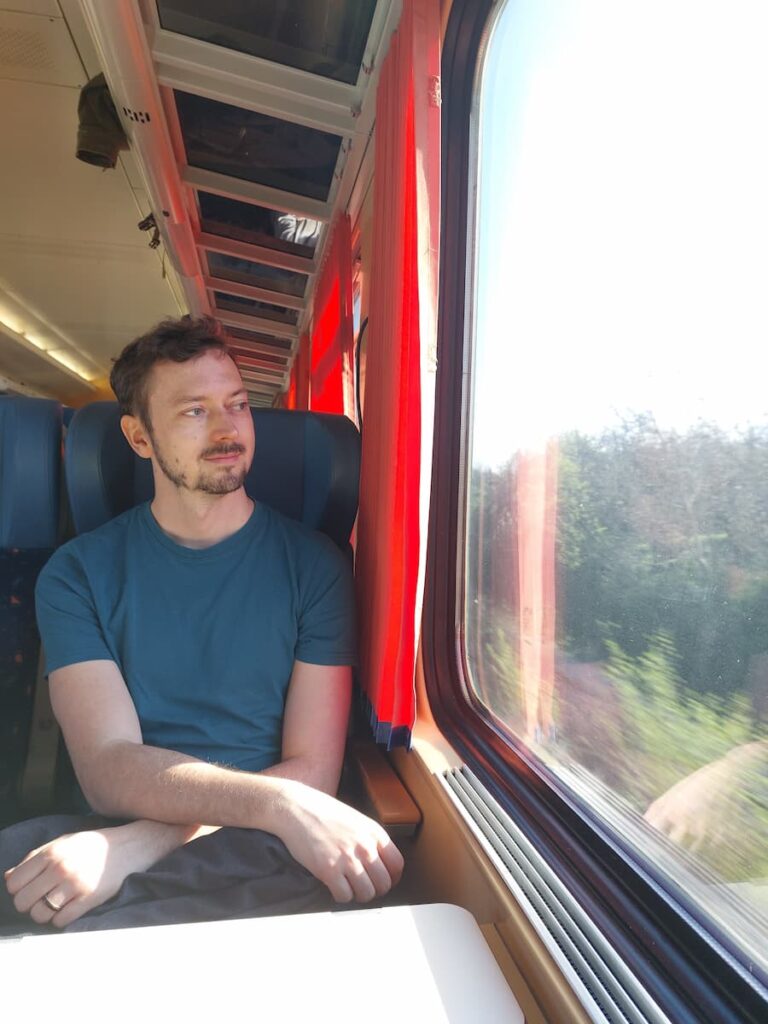 High Tatras on a Budget: 12 Money-Saving Tips 12 Daniel on a train going to the High Tatras mountains