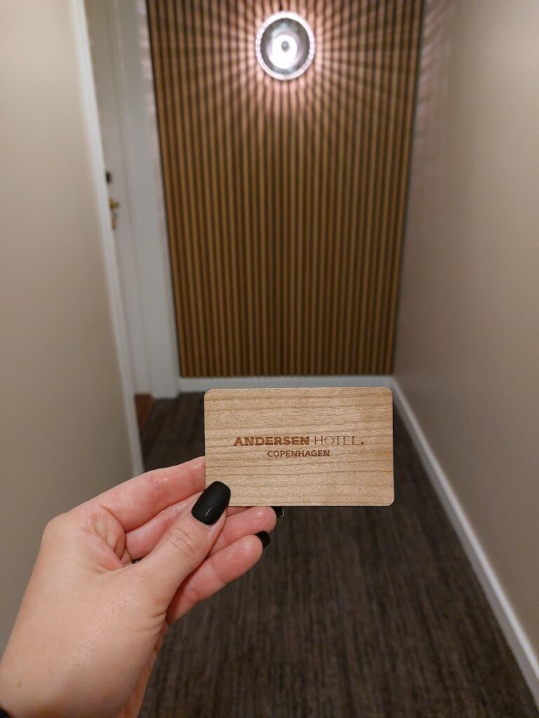 Wooden room key card at Andersen Hotel