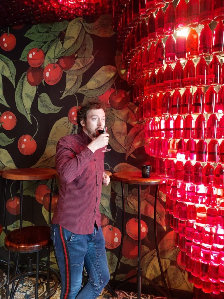 Daniel sipping a drink at the Piana Vyshnia bar