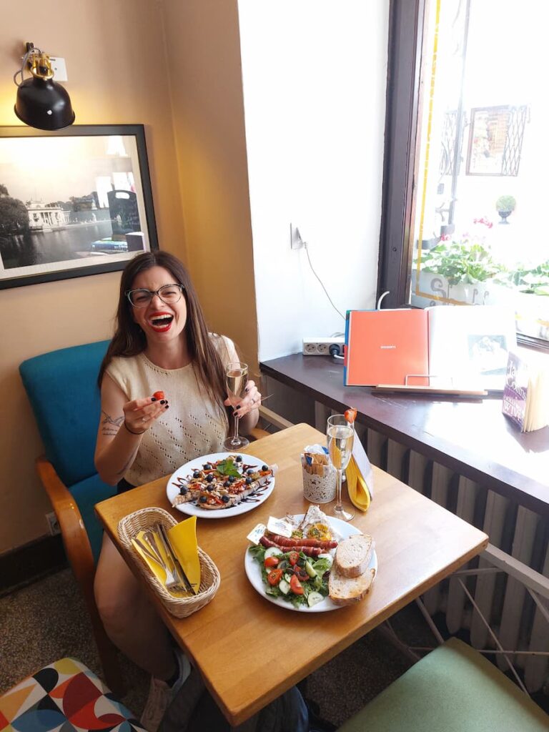 Mirka laughing at the Shabby Coffee cafe