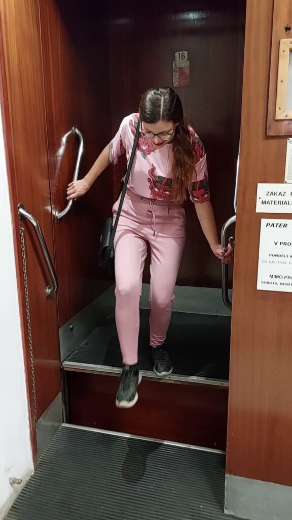 Paternoster Elevator in Prague: All You Need to Know 7 Mirka getting off the paternoster elevator in Prague