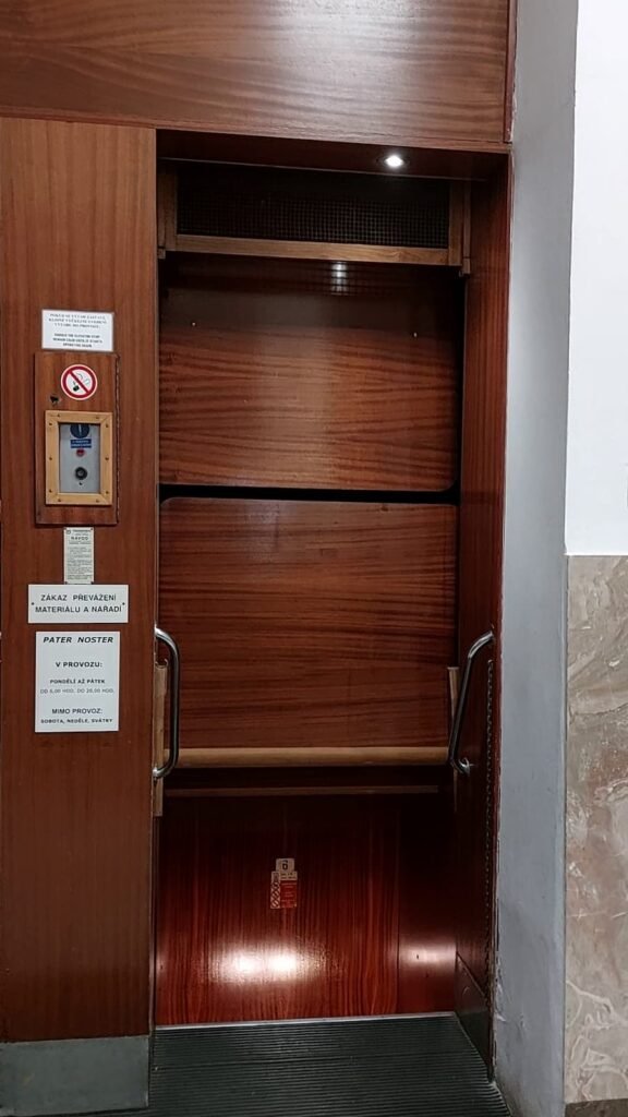 Paternoster Elevator in Prague: All You Need to Know 9 Signs on the paternoster elevator in Prague