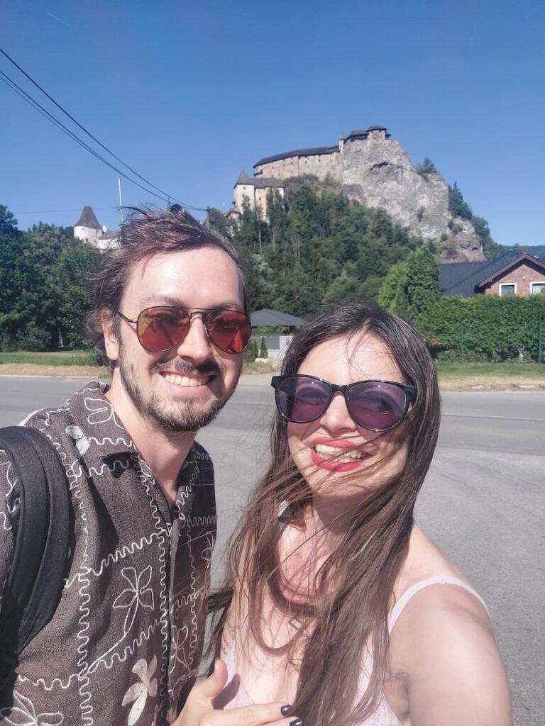 How to Visit Orava Castle Without a Car (+ Insider Tips) 1 Mirka and Daniel at Oravský Podzámok with Orava Castle in the background
