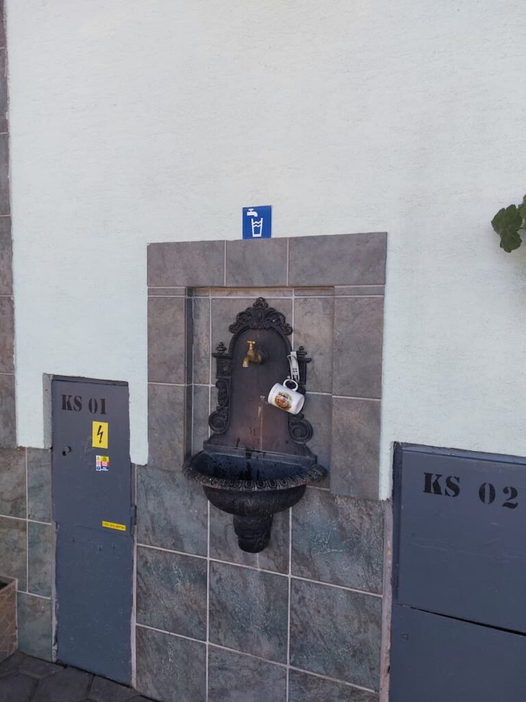 How to Visit Orava Castle Without a Car (+ Insider Tips) 8 Drinking water tap at Oravský Podzámok train station