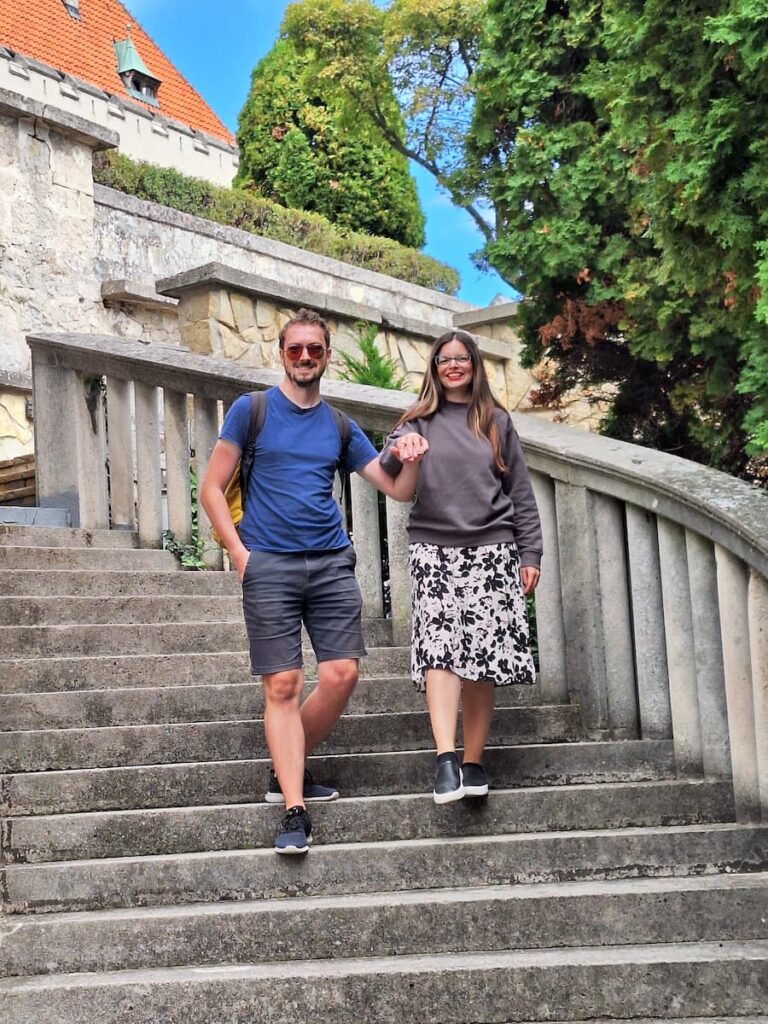 Mirka and Daniel walking down the staircase of Smolenice Castle