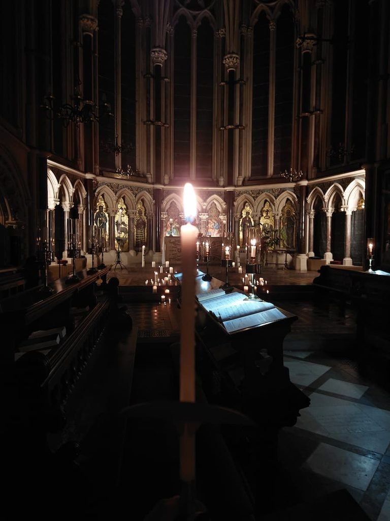 Candle in Exeter College chapel during an evensong in Oxford