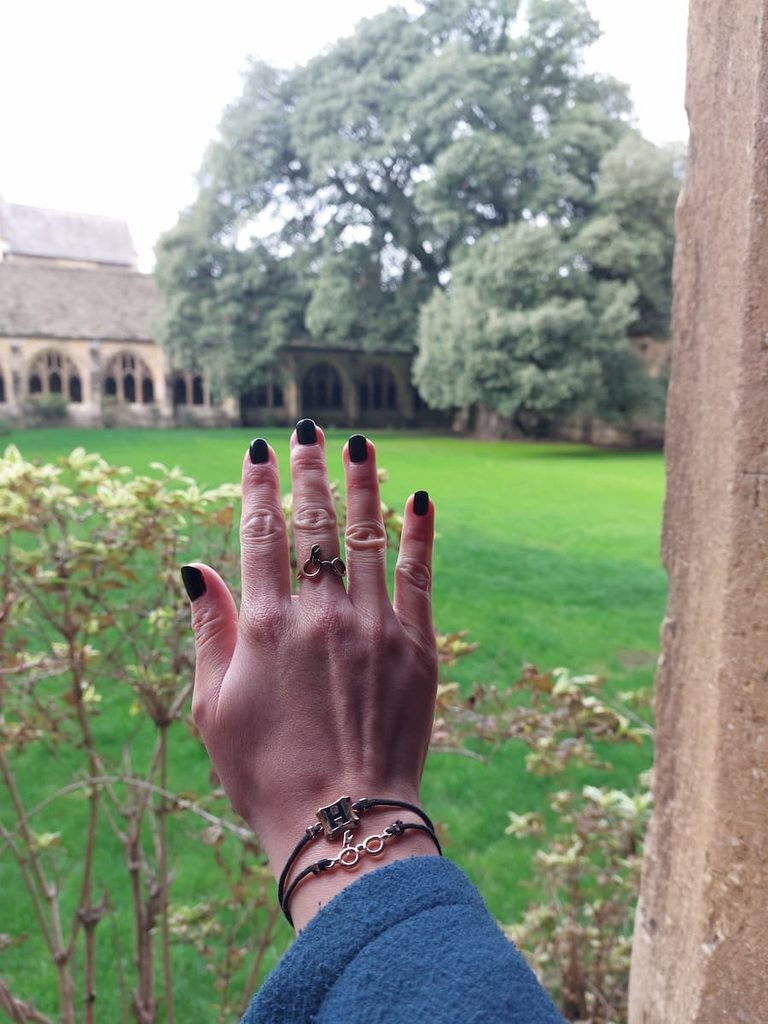 Mirka with Harry Potter jewellery in front of Malfoy tree in New College