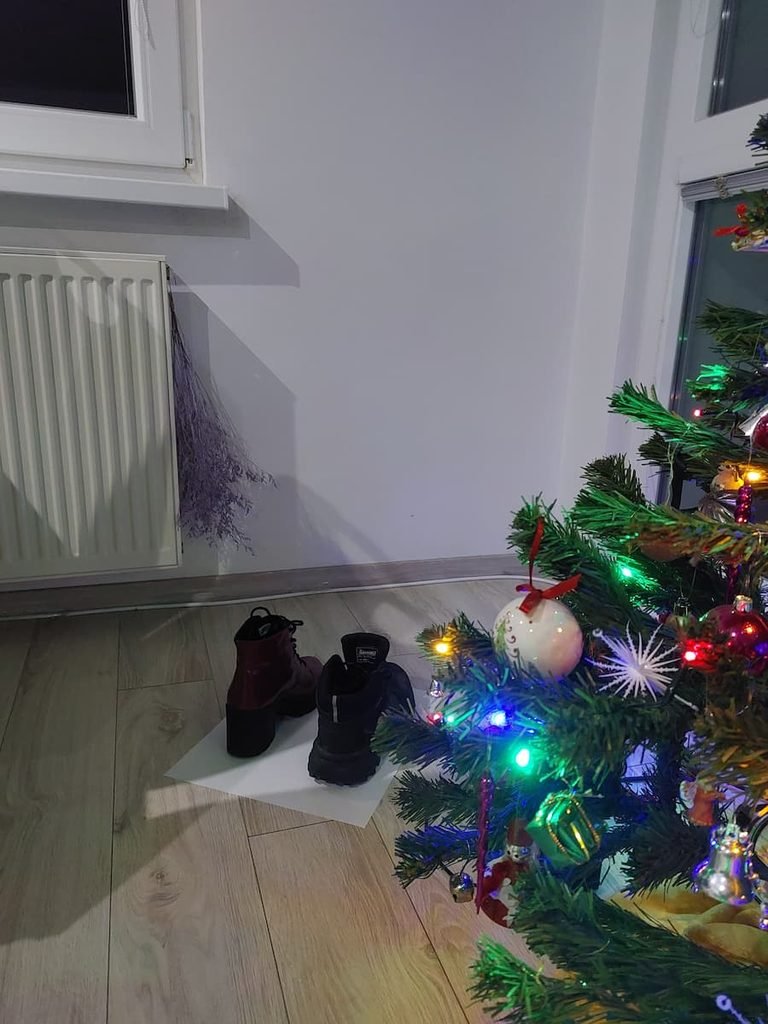 Winter boots by a window