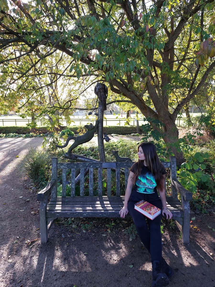 3 Days in Oxford: A Harry Potter & His Dark Materials Itinerary 3 Mirka sitting on Lyra's bench in Oxford Botanic Garden