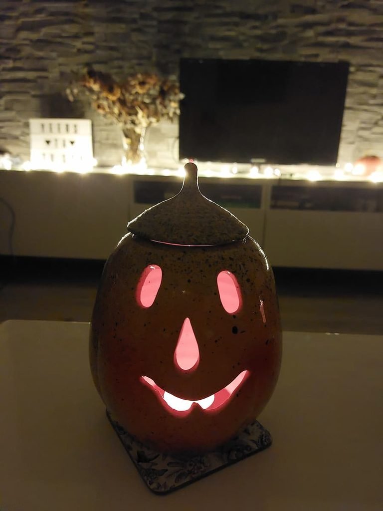 jack-o'-lantern with a candle